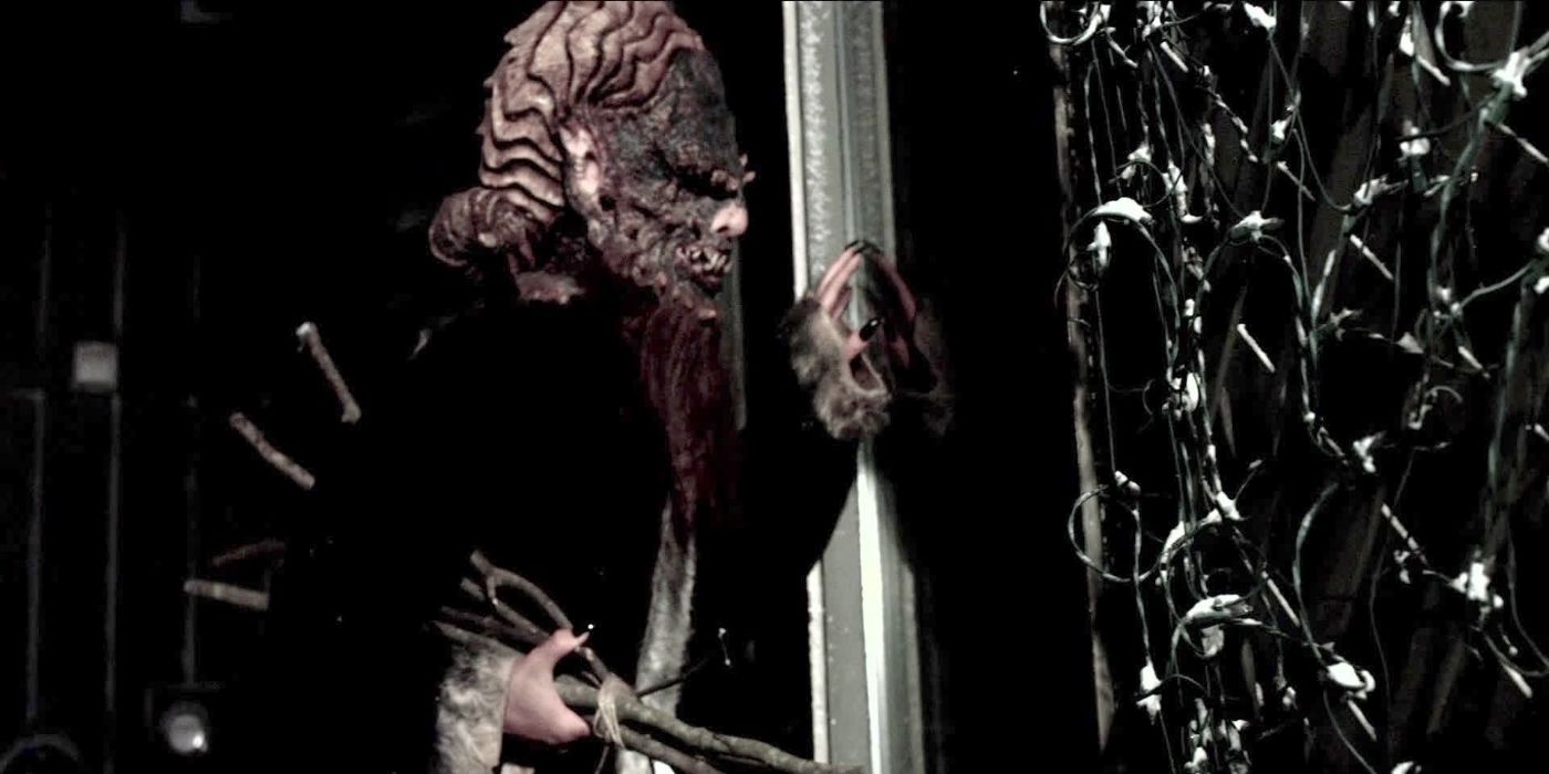 Krampus looks through a window in Krampus: The Devil Returns