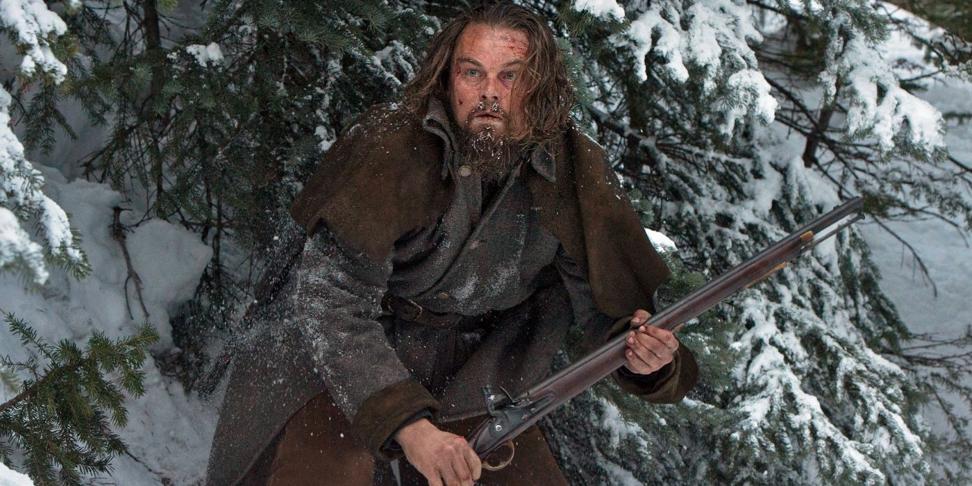 Leonardo DiCaprio as Hugh Glass, carrying a shotgun, in The Revenant