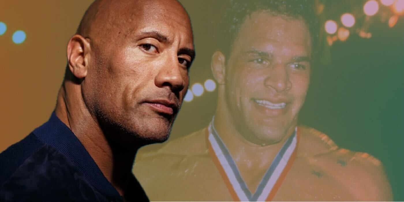 Dwayne Johnson with MMA fighter Mark Kerr wearing a medal ribbon around his neck