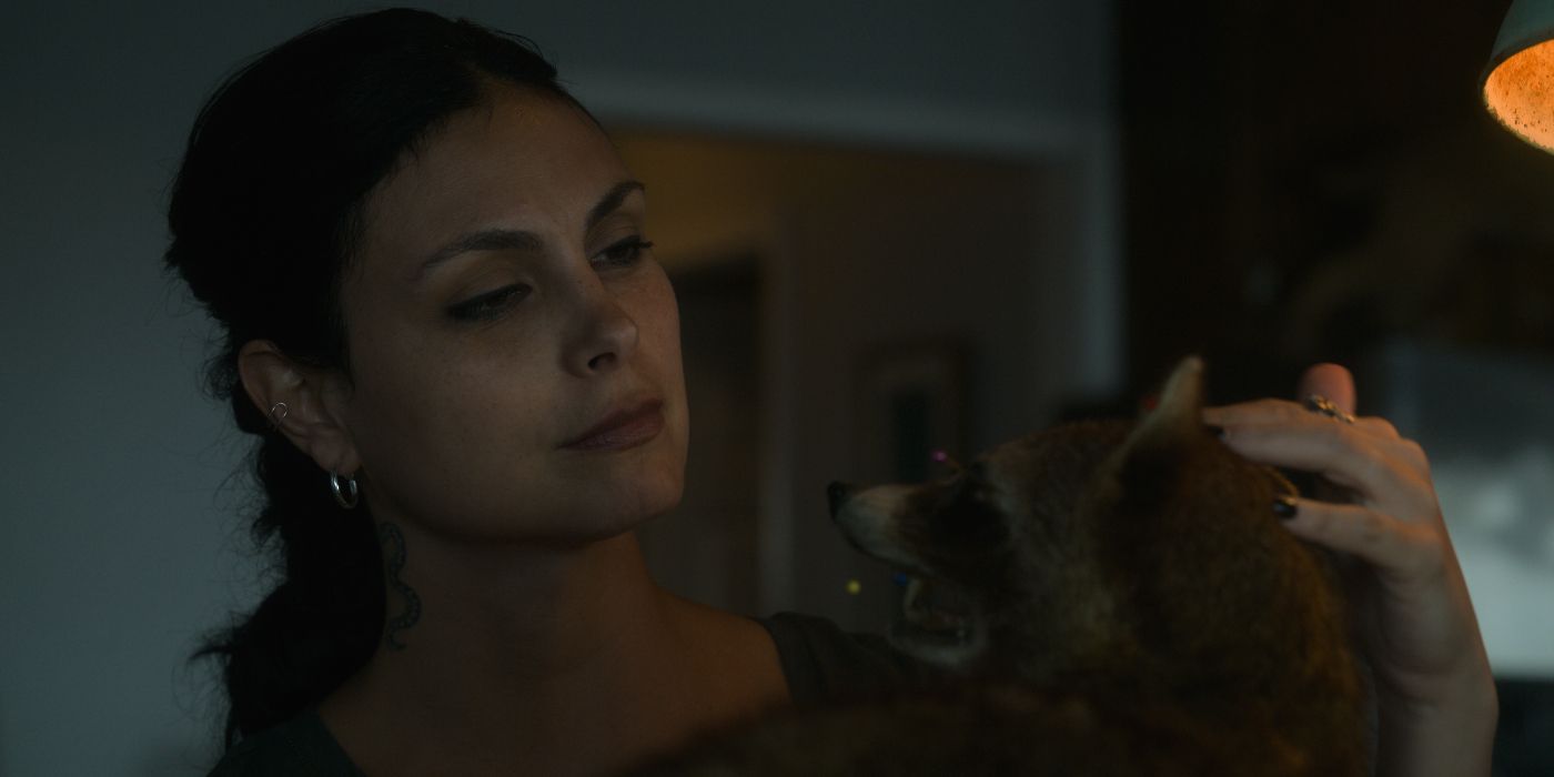 Morena Baccarin and a dog in Fast Charlie movie 2023
