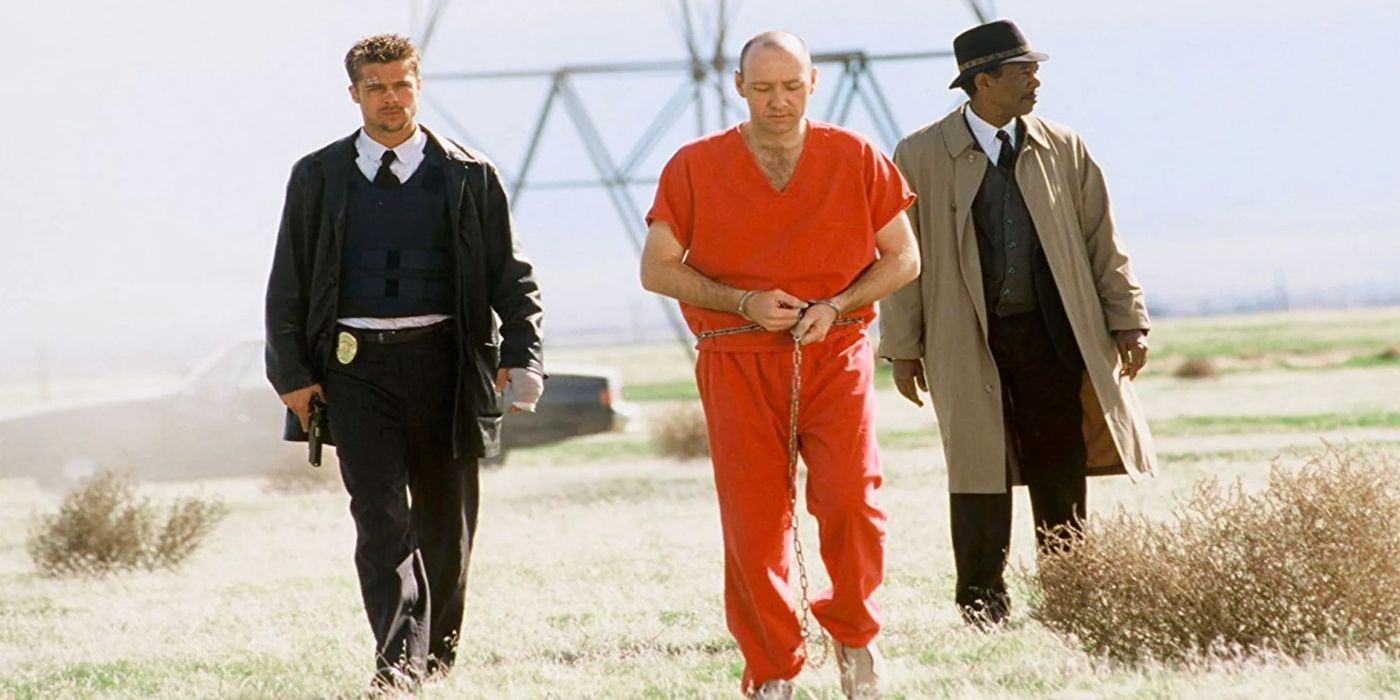 Morgan Freeman Brad Pitt Kevin Spacey in Se7en walking in a field in front of a power line