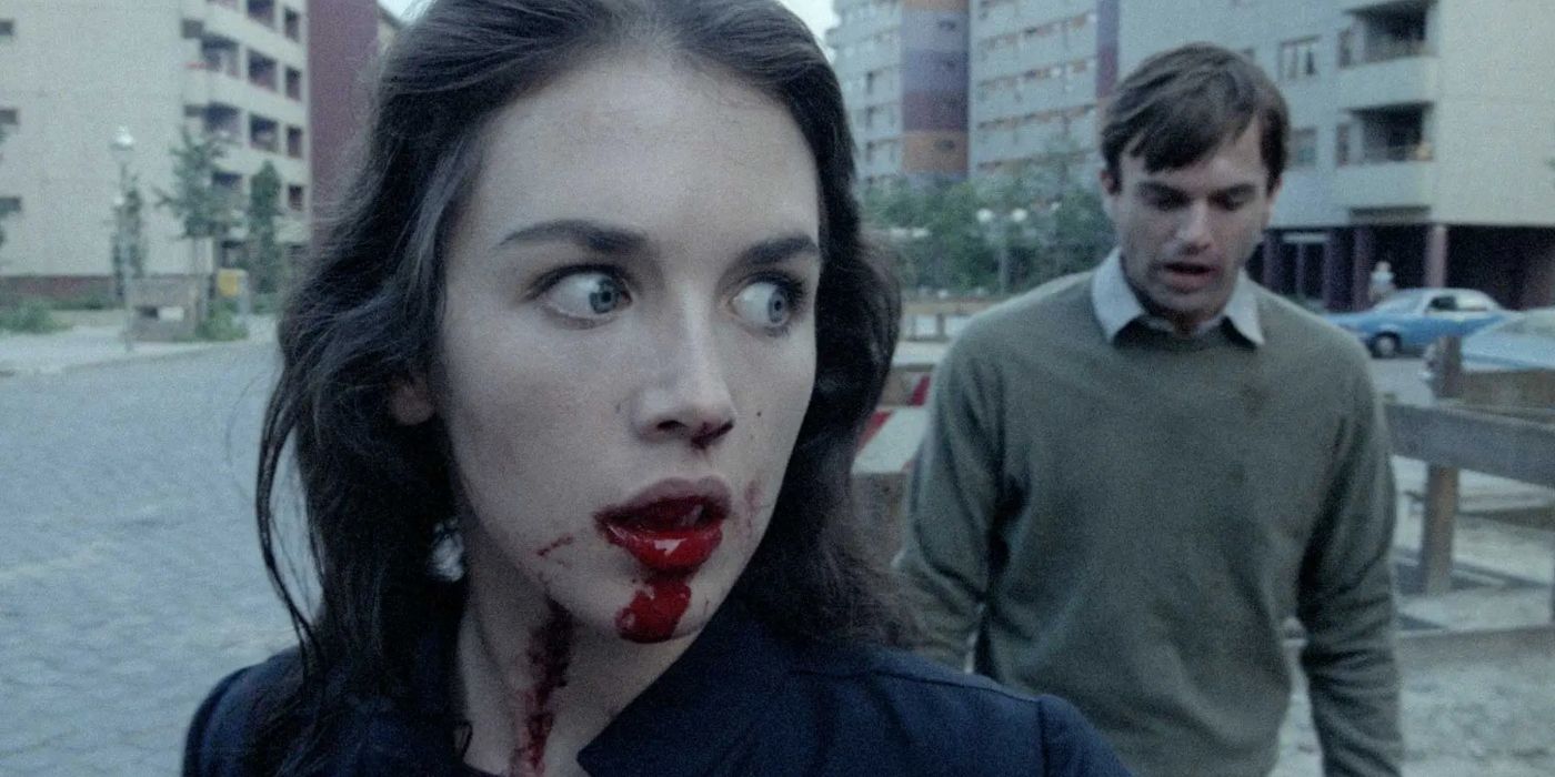 Isabelle adjani has a bloodied mouth as Sam neill tries to reach her in a scene from possession