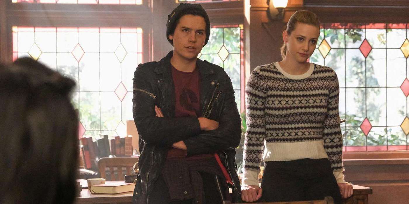 Riverdale Cole Sprouse as Jughead Jones and Lili Reinhart as Betty Cooper confront Jughead's classmates