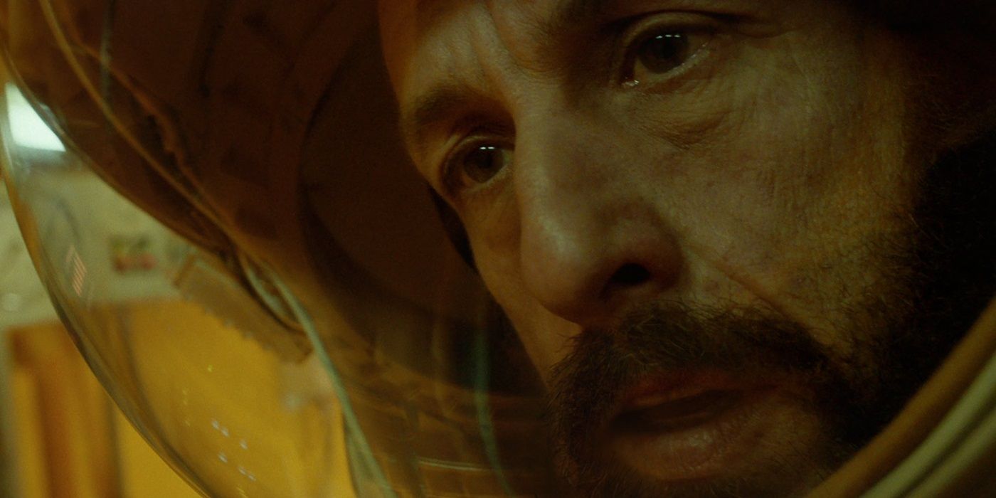 Adam Sandler looks scared while wearming a space helmet in the first trailer for Spaceman (2024)