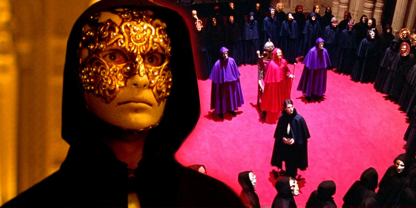 Tom Cruise as Bill Harford wearing a golden fancy mask with a hood on and a room full of people with cloaks in Eyes Wide Shut