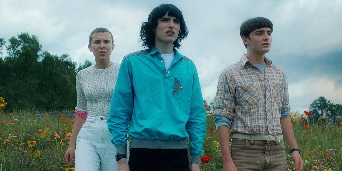 Eleven, Mike, and Will look on in terror at the end of Stranger Things season four.