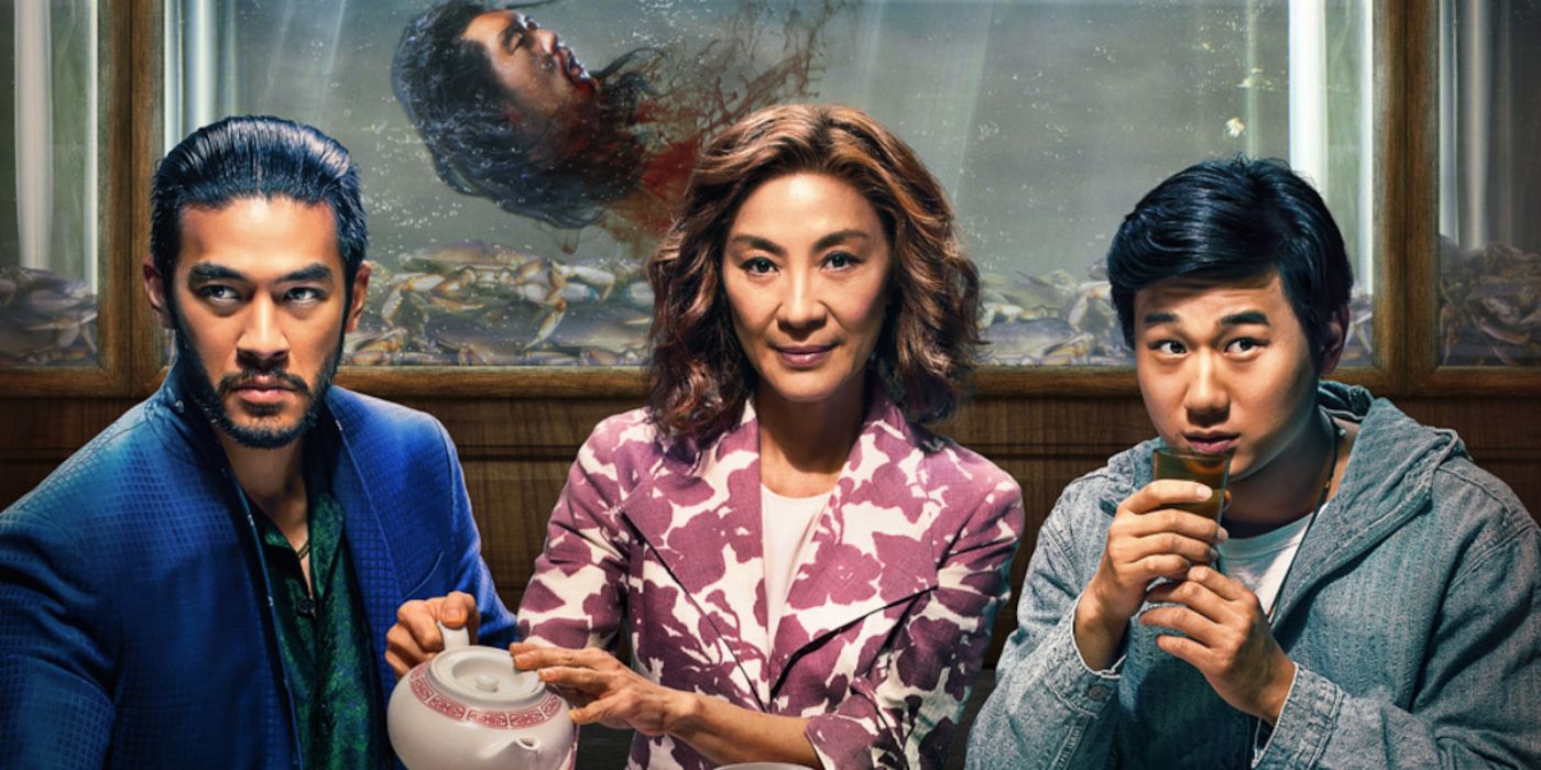 Michelle Yeoh as Eileen, Justin Chien as Charles, and Sam Song Li as Bruce at a dinner table with a head floating in a fish tank in the background in The Brothers Son