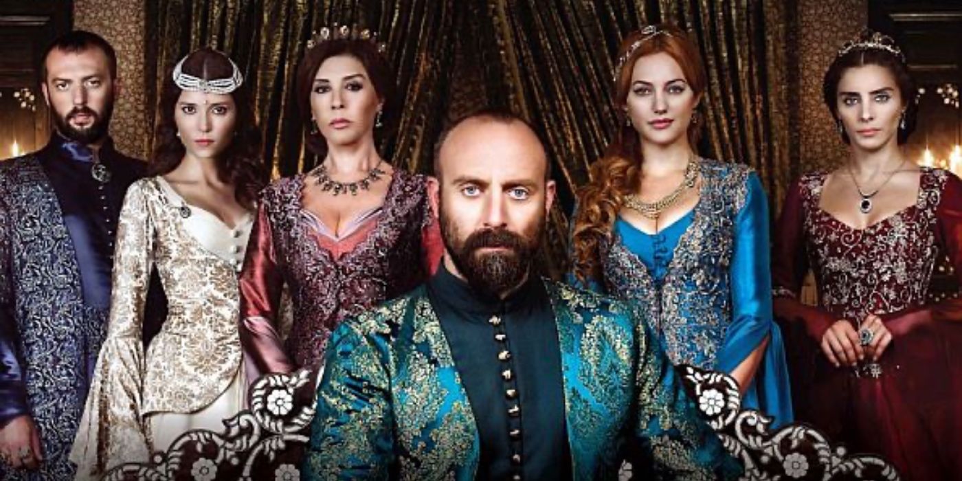 A Turkish royal family pose in lavish garments.