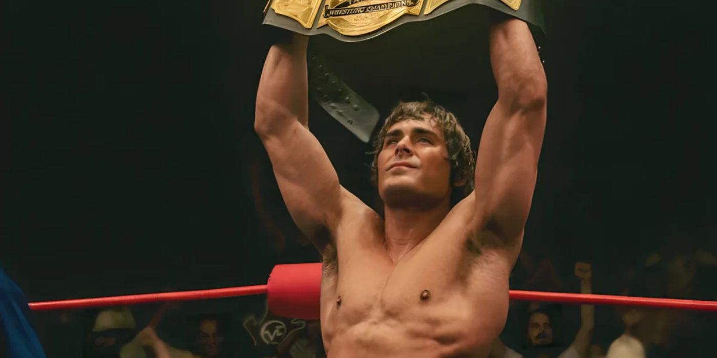 Zac Efron holds a champion wrestling belt in The Iron Claw