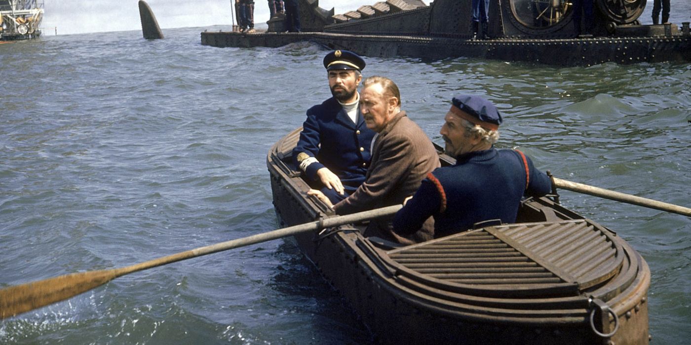 James Mason as Captain Nemo, Kirk Douglas as Ned Land, and Peter Lorre Conseil, sitting on a rowboat in 20,000 Leagues Under the Sea