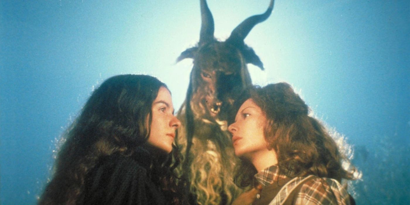 Tina Romero as Alucarda and Susana Kamini as Justine standing face-to-face while a goat-like creature looms above them