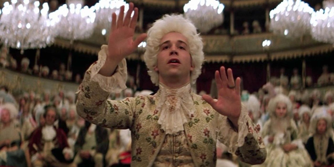 Wolfgang Amadeus Mozart played by Tom Hulce conducts music at a performance