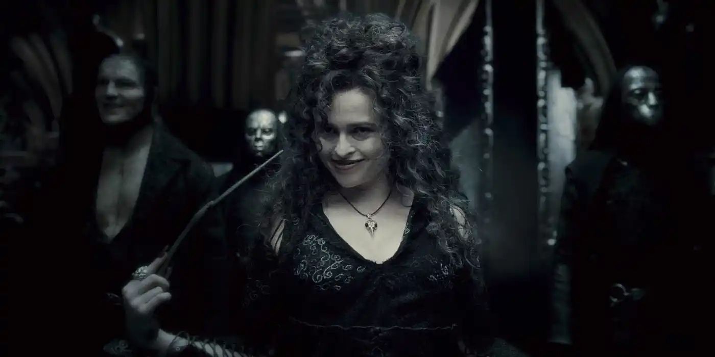 Helena Bonham Carter as Bellatrix Lestrange smiles menacingly as Death Eaters form up behind her