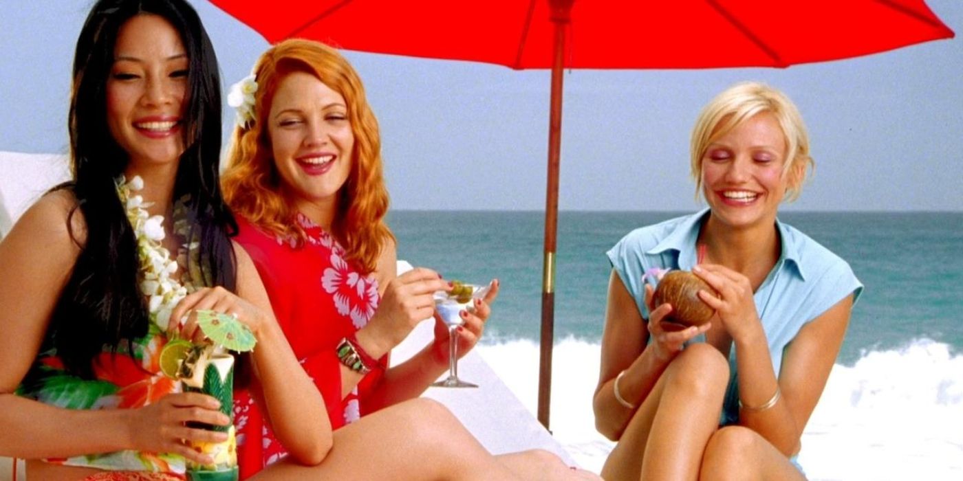 Lucy Liu, Drew Barrymore, and Cameron Diaz drinking on a beach