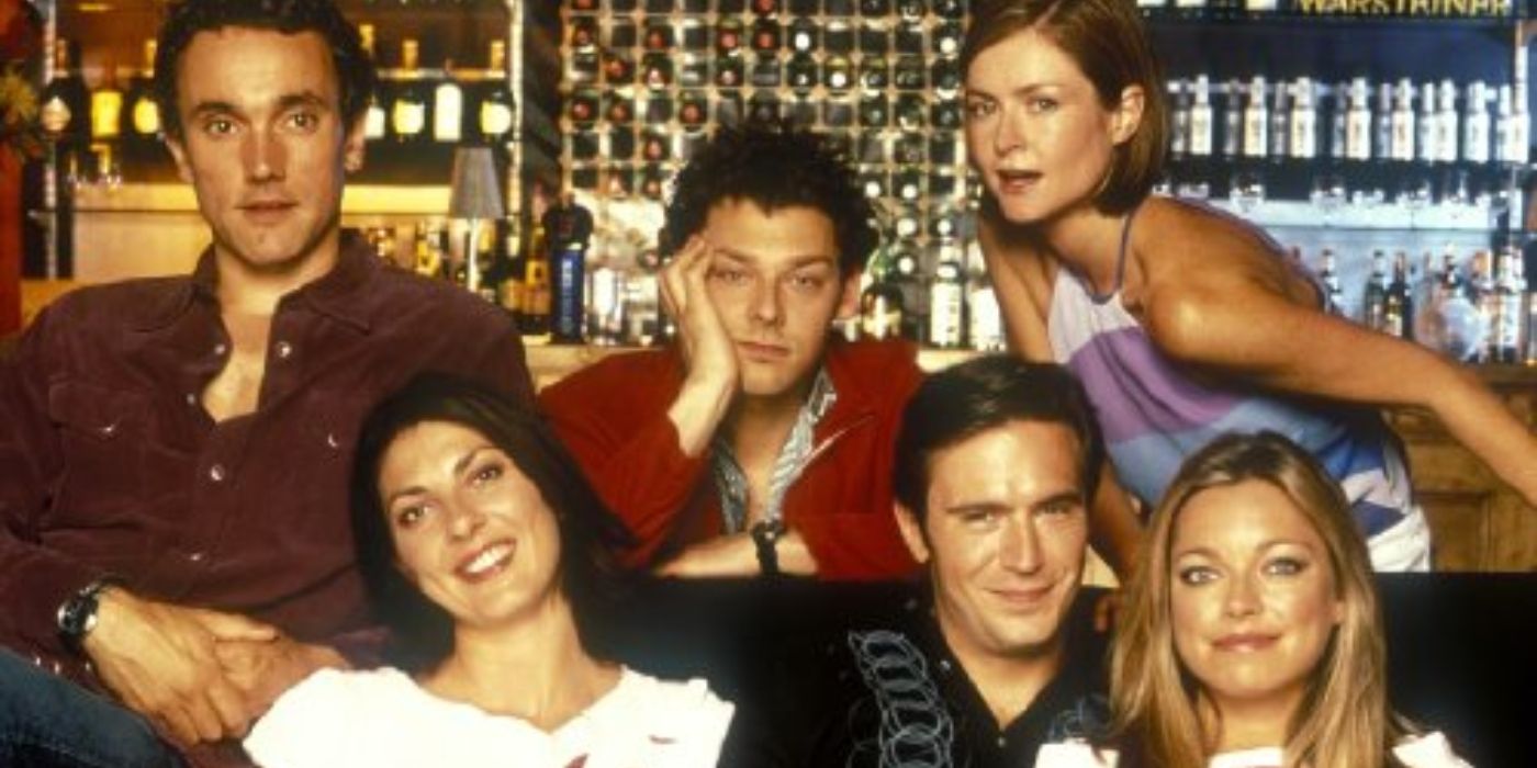 The main cast of Coupling poses for the poster image in a British pub