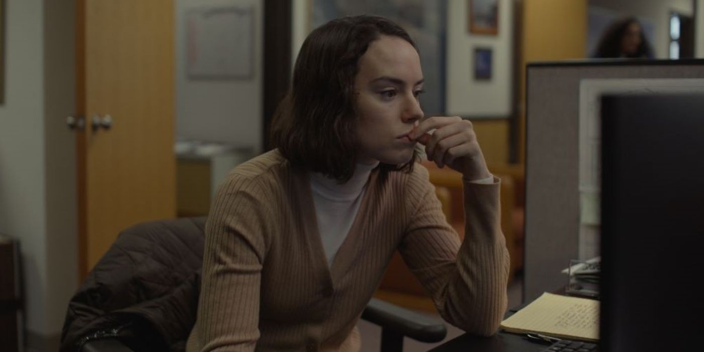 Daisy Ridley in a sweater watching the computer in Sometimes I Think About Dying
