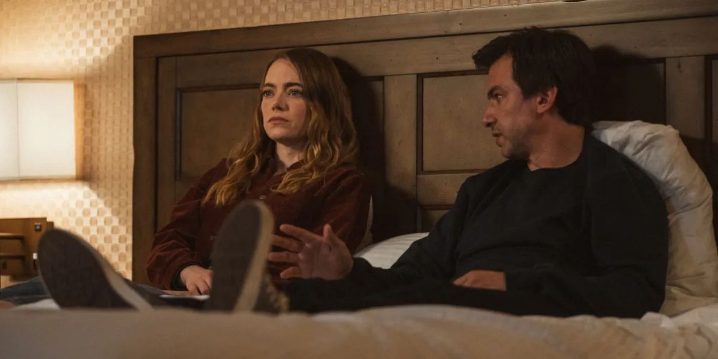 Emma Stone and Nathan Fielder in bed in The Curse
