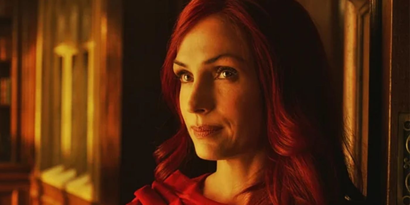 Famke Janssen as Phoenix, with red hair and a red dress, in X-Men: The Last Stand