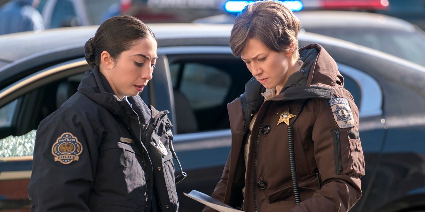 Carrie Coon as Gloria Burgle, examining a document with another police offer, in Fargo Season 3