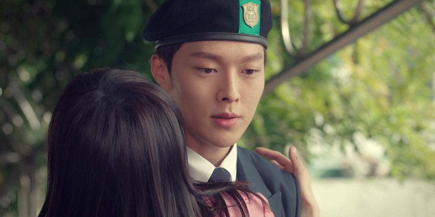 Son Ho-jun as Choi Ban-do, wearing a military beret and black suit, receives a hug from a young woman in Go Back Couple