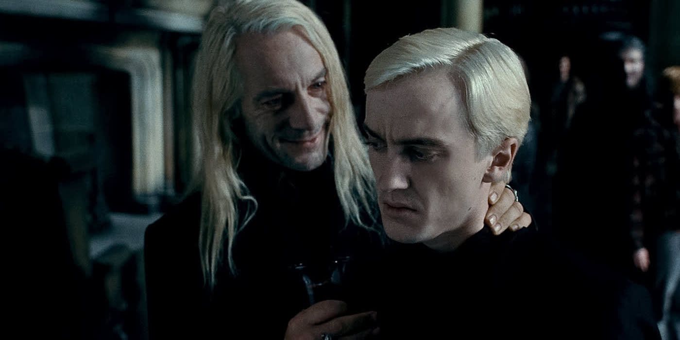 Harry Potter and the Deathly Hallows: Part 1 Jason Isaacs as Lucius tries to convince Tom Felton as Draco to reveal Harry's identity because it will please Voldemort