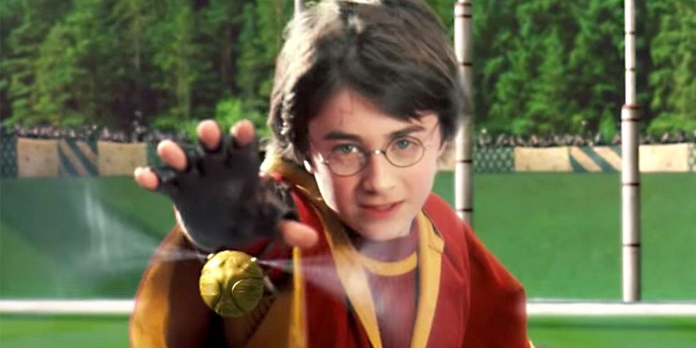 Harry Potter and the Sorcerer's Stone Daniel Radcliffe as Harry catches the Snitch in his first Quidditch game