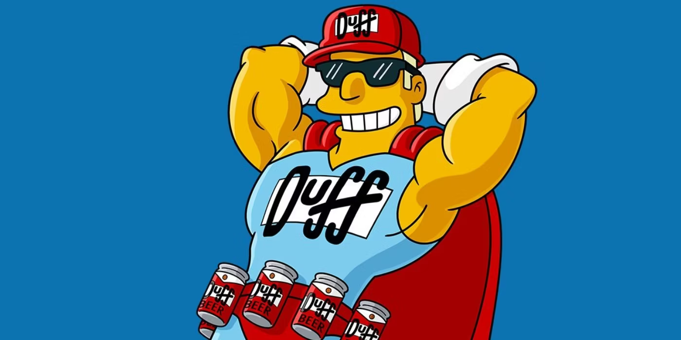 Duff Man is wearing a red duff cap and a red cape. His leotard is blue with a duff logo and beer cans make up his belt.