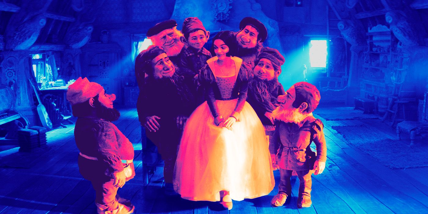 Rachel Zegler as Snow White surrounded by the dwarfs in the live action remake