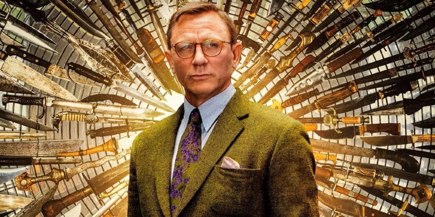 Daniel Craig as Benoit-Blanc standing in front of a display of knives in Knives Out.