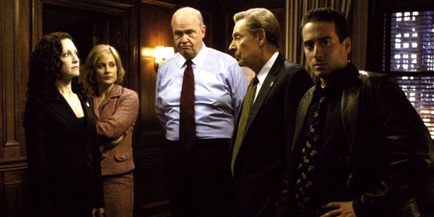 The cast of Law & Order: Trial by Jury stands in an office