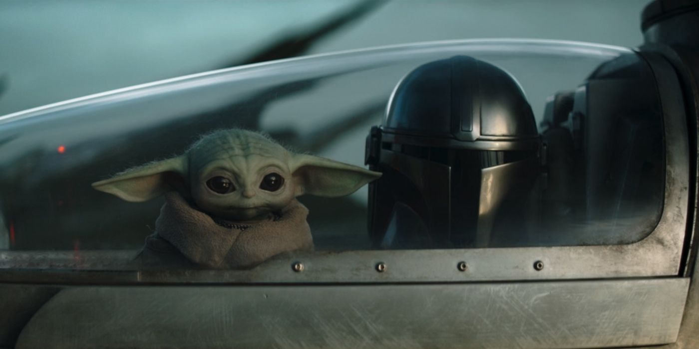 Pedro Pascal as The Mandalorian sitting a cockpit with Grogu in The Mandalorian Chapter 18