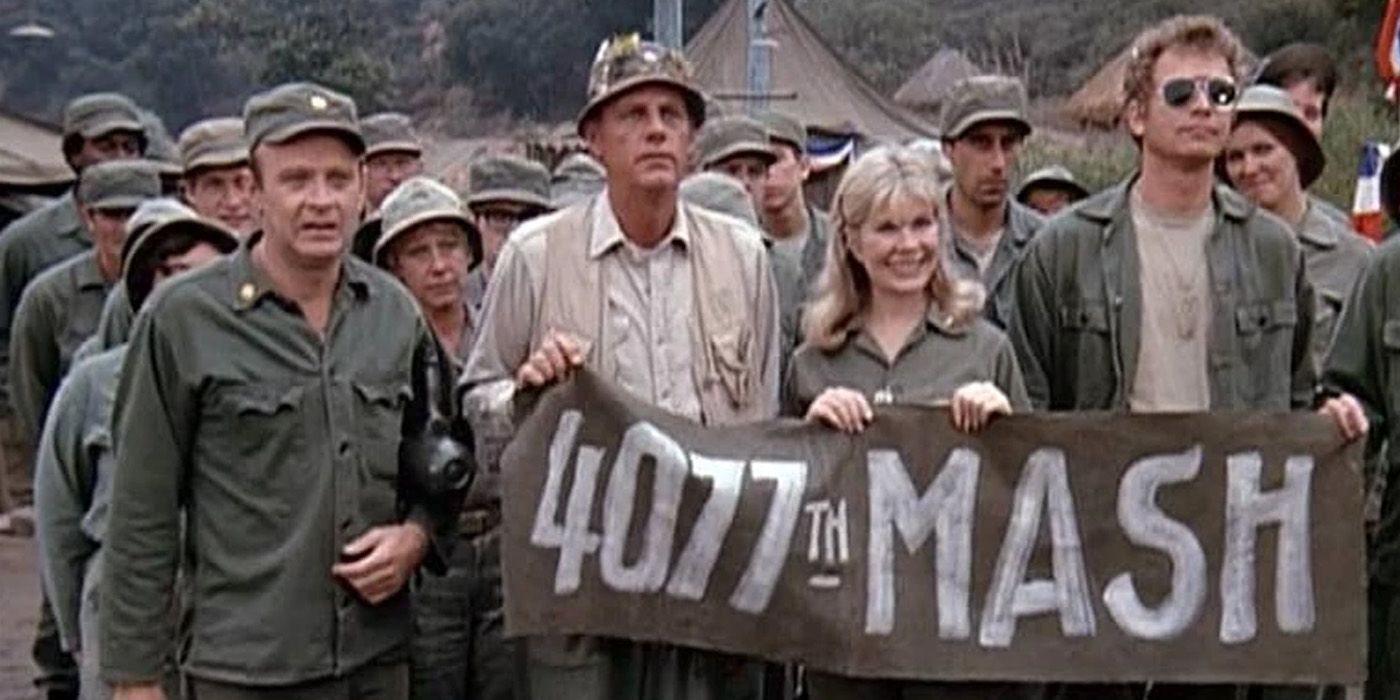 The cast of M*A*S*H participating in a marching scene
