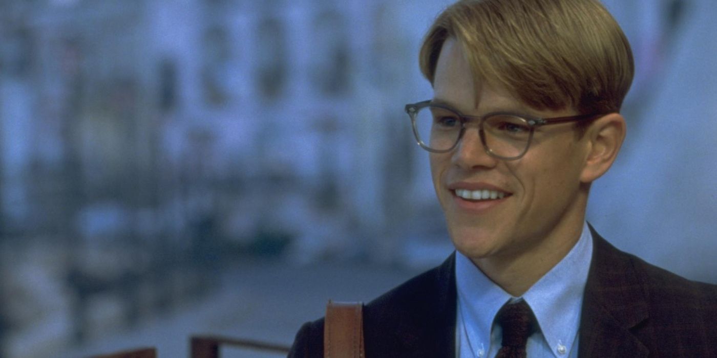 Matt Damon as Tom Ripley, with dorky glasses and a charming grin, in The Talented Mr. Ripley