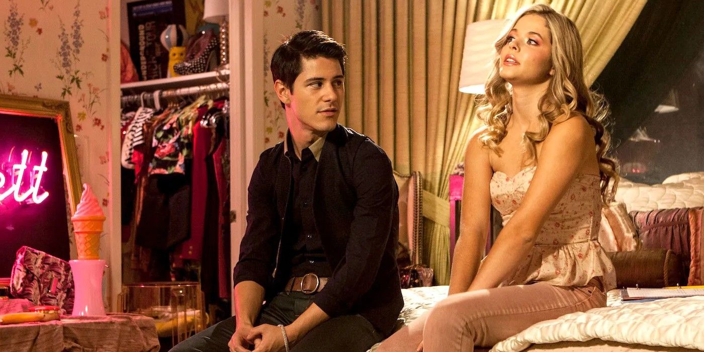 Michael J. Willett as Tanner and Sasha Pieterse as Fawcett, sitting next to each other on a bed, in G.B.F.