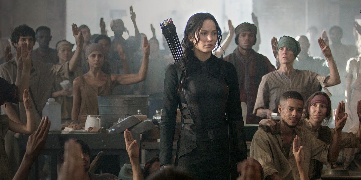 Mockingjay: Part 1 Jennifer Lawrence as Katniss is saluted by District rebels