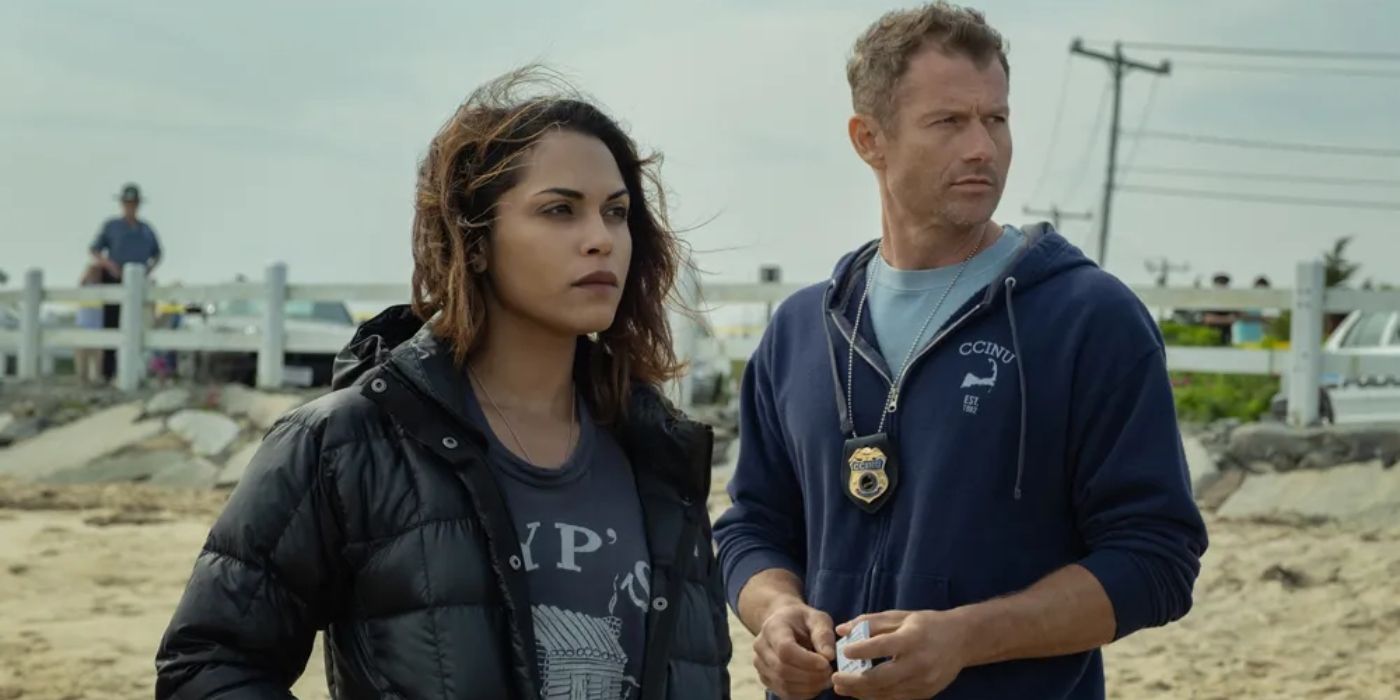 Monica Raymund as Jackie and James Badge Dale as Ray stand on a beach in Hightown