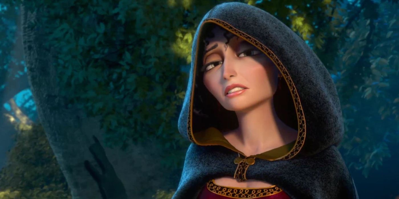 Mother Gothel wearing a hooded clock in the forest in Tangled