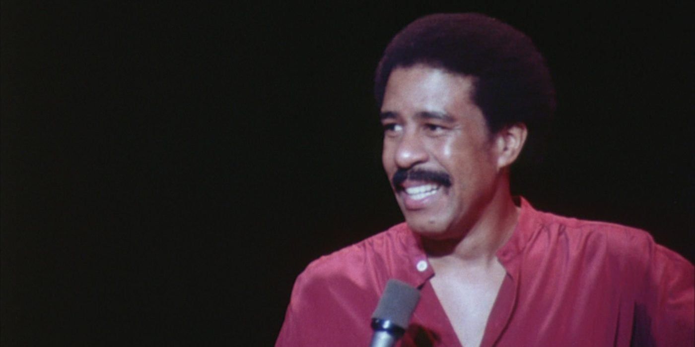 Richard Pryor holding a microphone during a stand-up routine