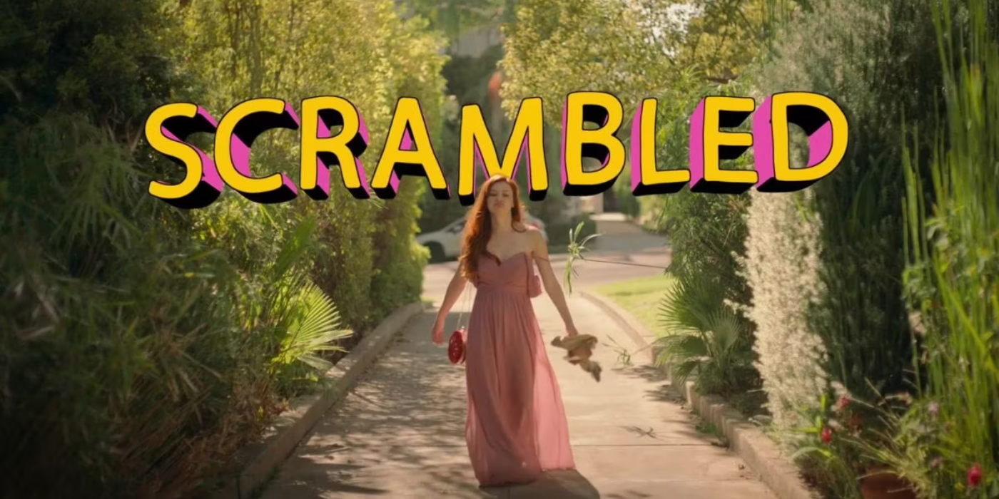 Leah McKendrick as Nellie walking down the sidewalk in a pink dress in Scrambled