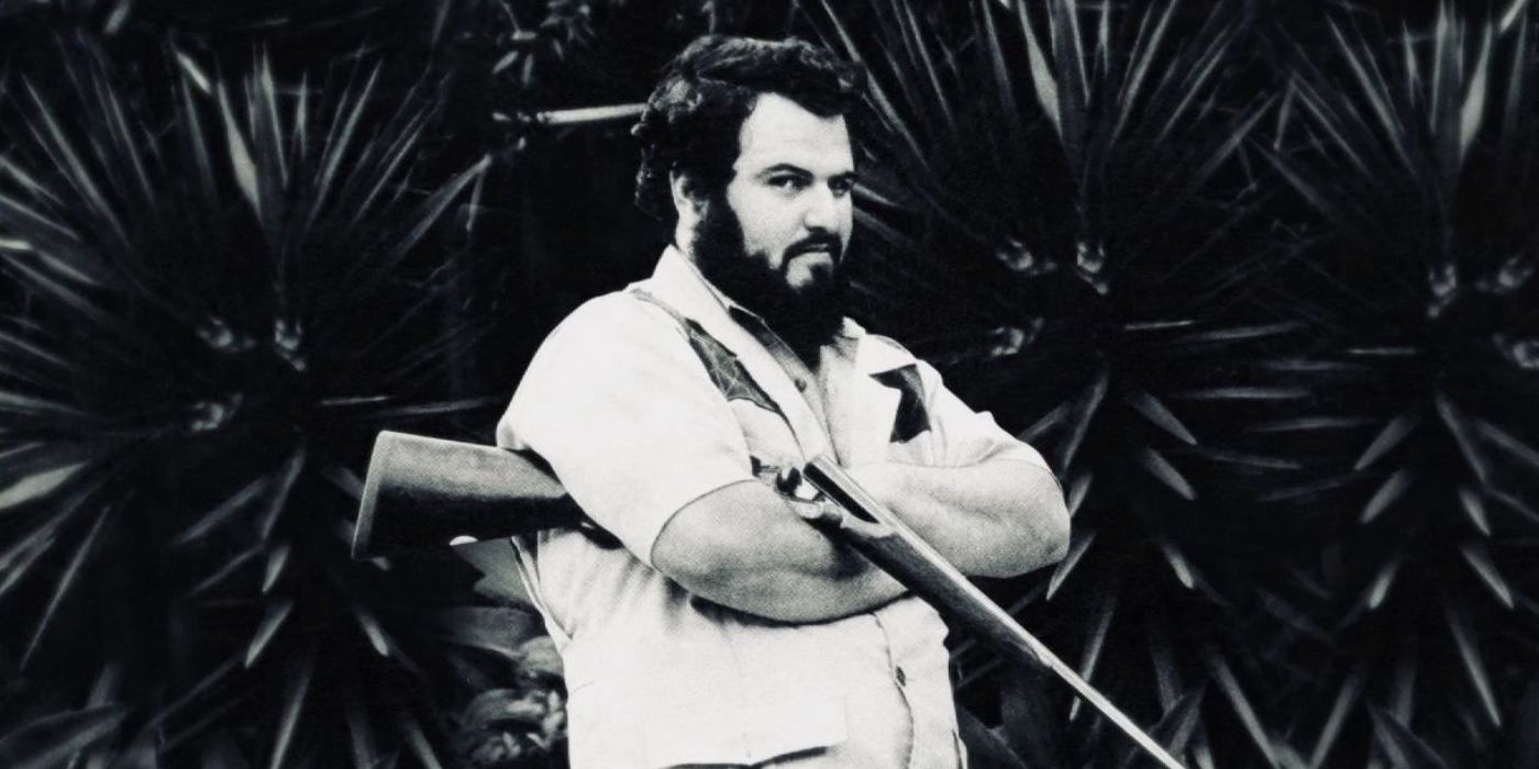 John Milius totes a shotgun in the promotion for MGM's Red Dawn