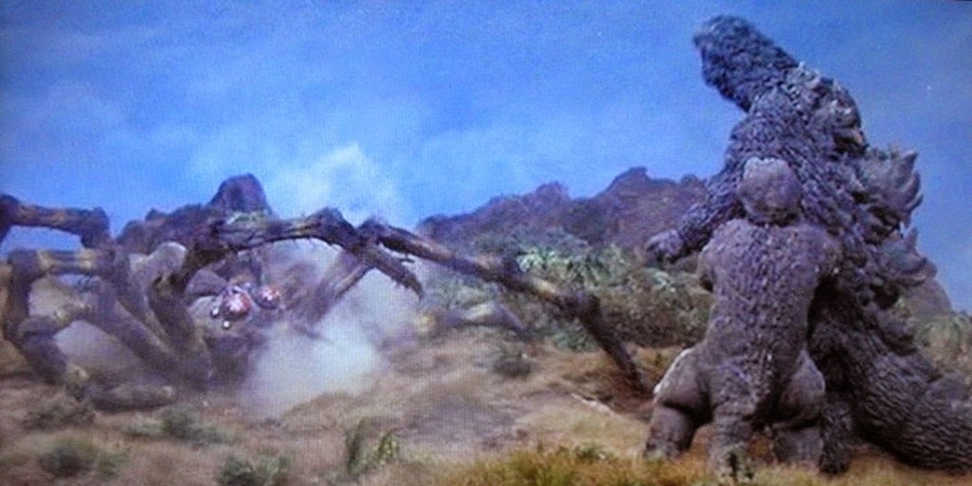 Godzilla protects his son, Minilla, from a giant spider-like creature