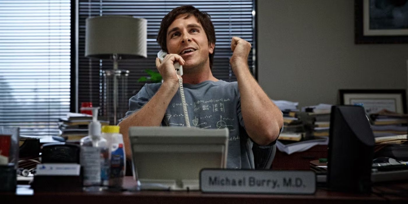 The Big Short Michael Burry sitting at a desk on the phone