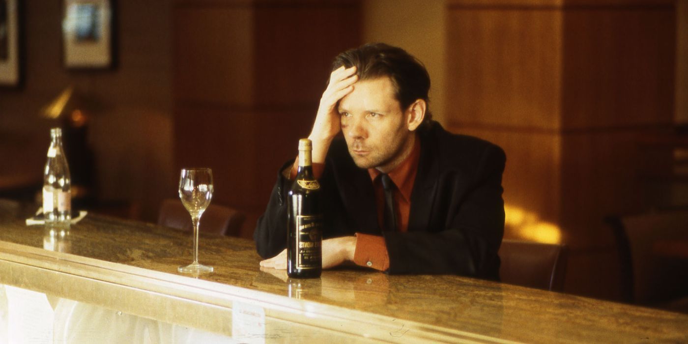 Martin Donovan as Jesus sitting alone at a bar