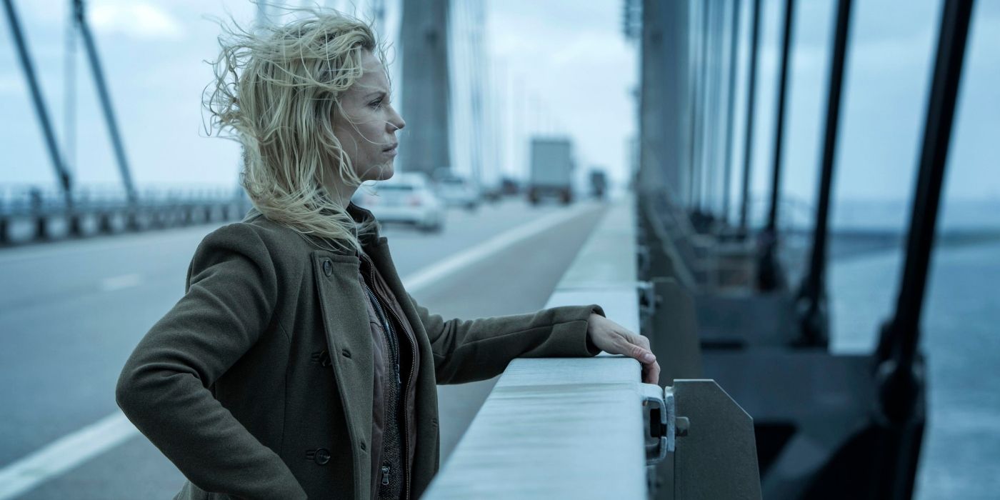 Sofia Helin as Saga, standing against the railing of a bridge, in the Bridge