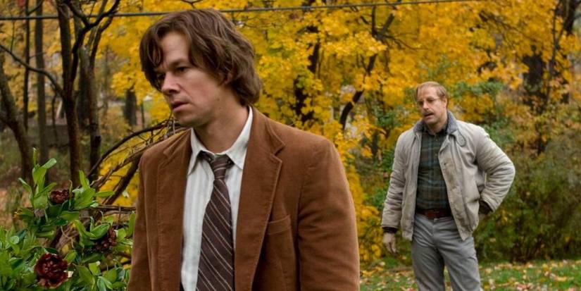 Mark Wahlberg as Jack Salmon and Stanley Tucci as George Harvey, standing in an autumn landscape, in The Lovely Bones