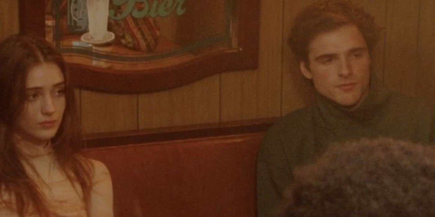 Jacob Elordi's character in The Sweet East sits in a low-lit bar