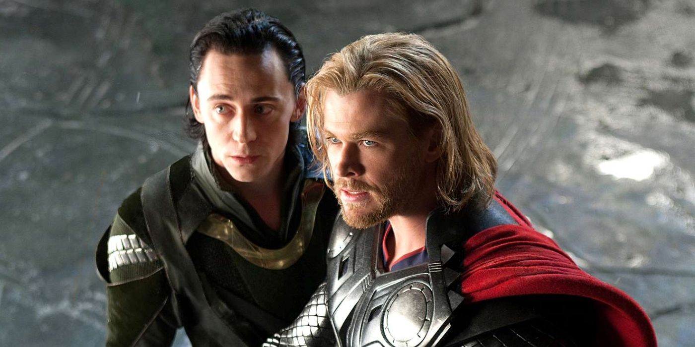 A high-angle shot of Loki and Thor standing closely together