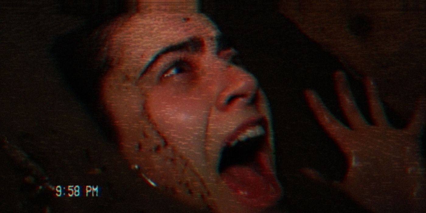 A camcorder image of a woman screaming