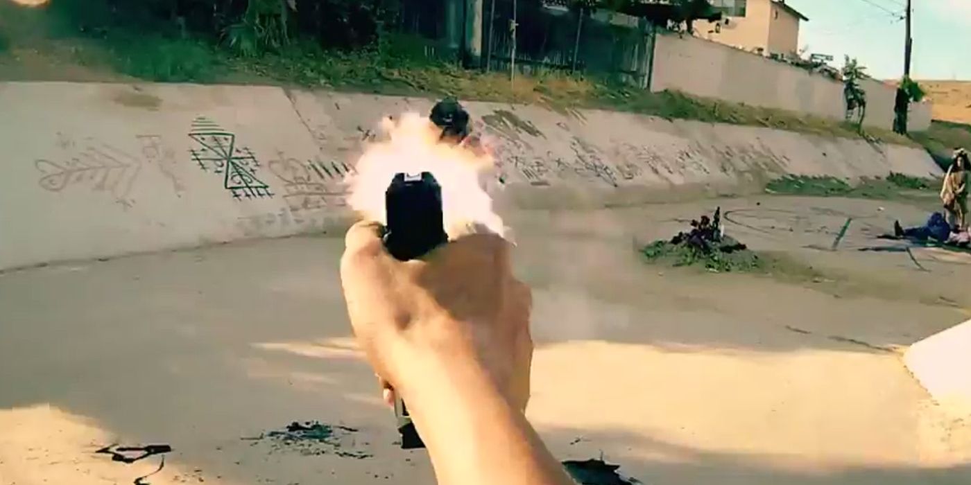 A first-person shooter game-like image of a hand firing a gun