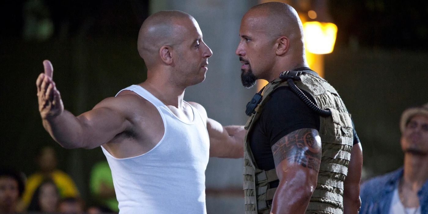 Vin Diesel and Dwayne Johnson facing off and challenging each other as Dominic and Luke in Fast Five
